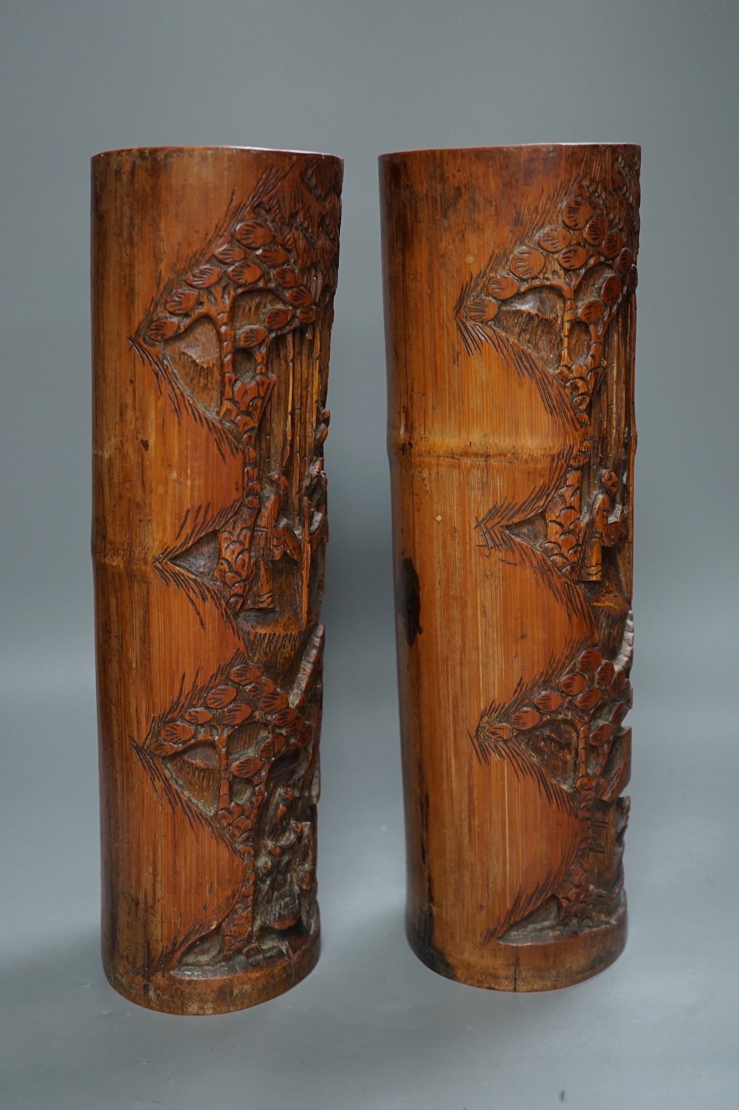 A pair of Chinese carved bamboo brush pots, 35 cms high